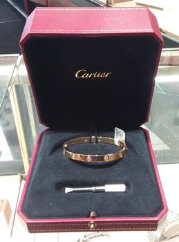 Cartier 29.9g 18k w/dia $13000.00